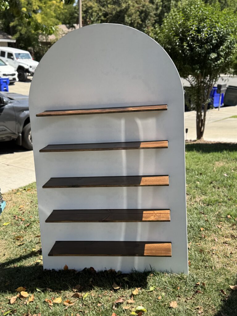 Arched wall shelf